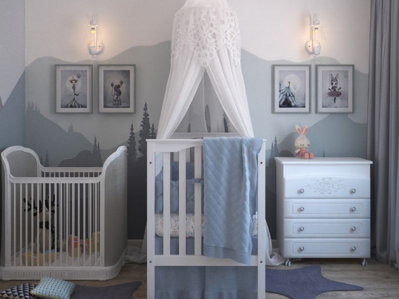 quarto de bebê com a parede toda pintada e um berço no meio