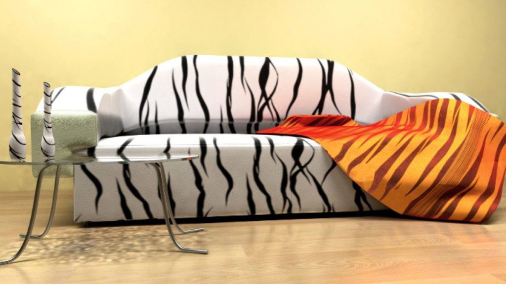 sofá zebrado com manta de estampa de tigre