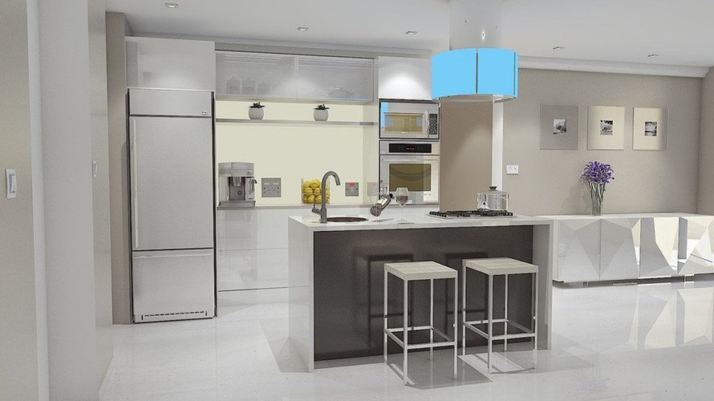 geladeira, armários de teto, bancadas e banquinhos em uma cozinha com as paredes da cor cinza