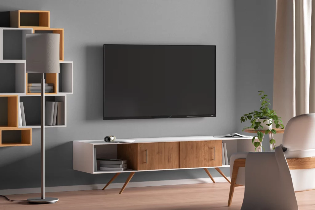 Imagem da decoração de uma sala de estar com um rack sem painel para ilustrar matéria sobre ideias de decoração para sala com rack