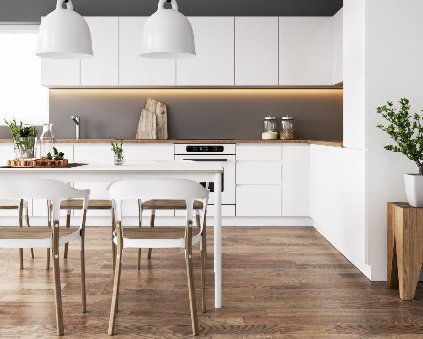 Imagem que ilustra matéria sobre cozinha minimalista mostra uma cozinha minimalista com mesa, armários,