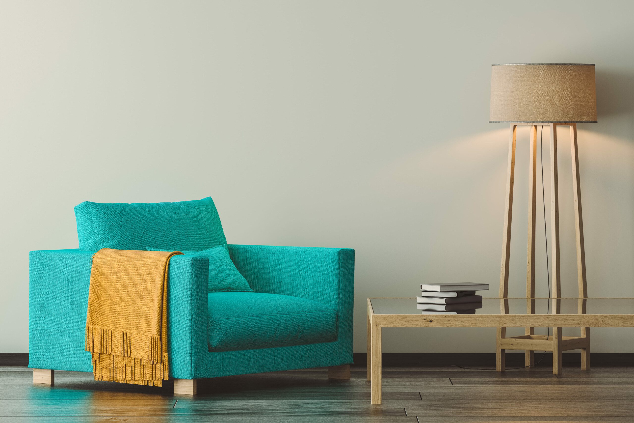 Image of a turquoise blue armchair with a low wooden side table and floor lamp. 