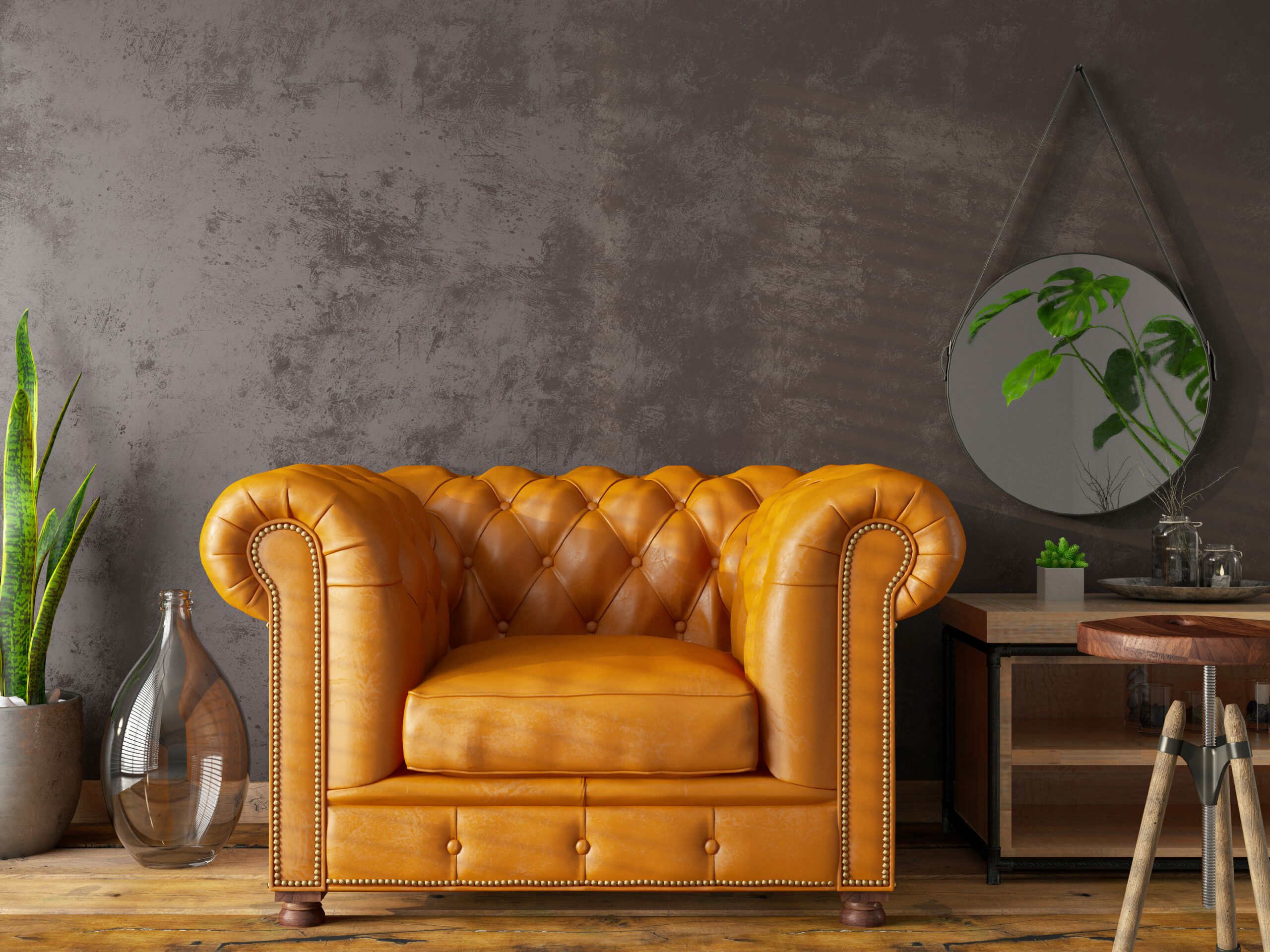 Image of a leather armchair in mustard color.